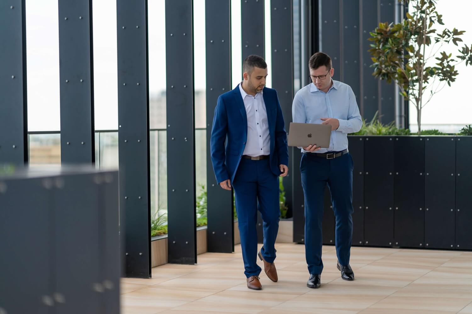 Digital Marketing Tribe consultants reviewing results on a laptop