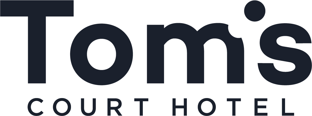 Tom's Court Hotel logo
